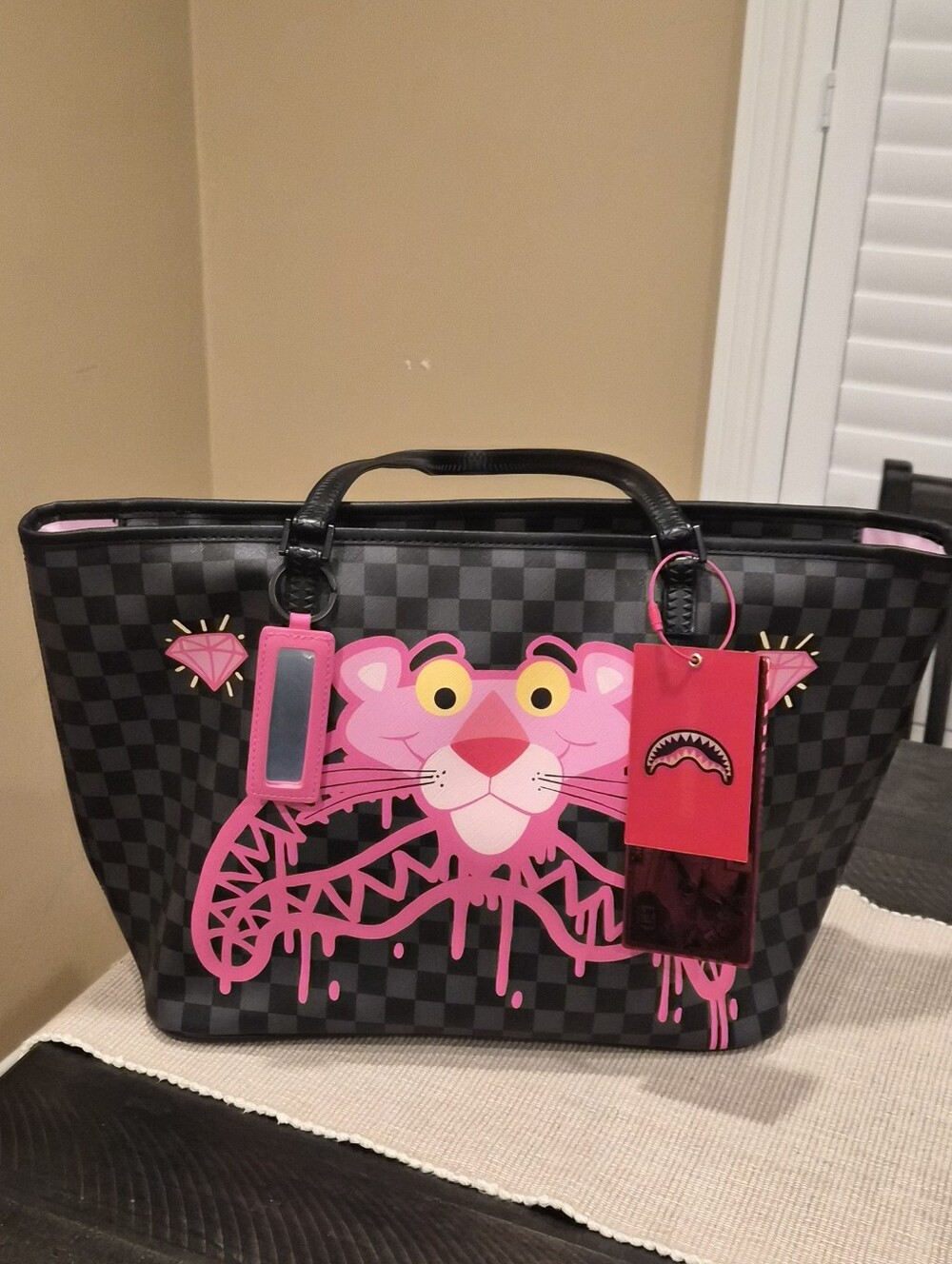 Sprayground Black Checkered Tote with Pink Panther Graphic